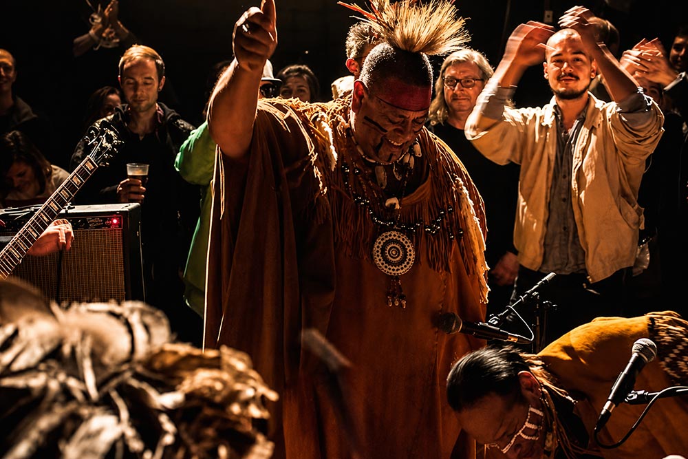 Indigenous community members participating in a cultural gathering celebrating Native traditions, heritage, and shared history.